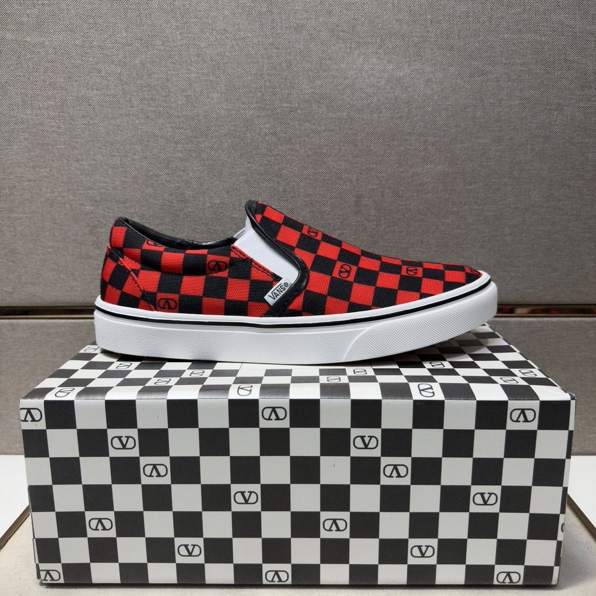 Vans Red and Black Checkerboard Slip-On Sneakers