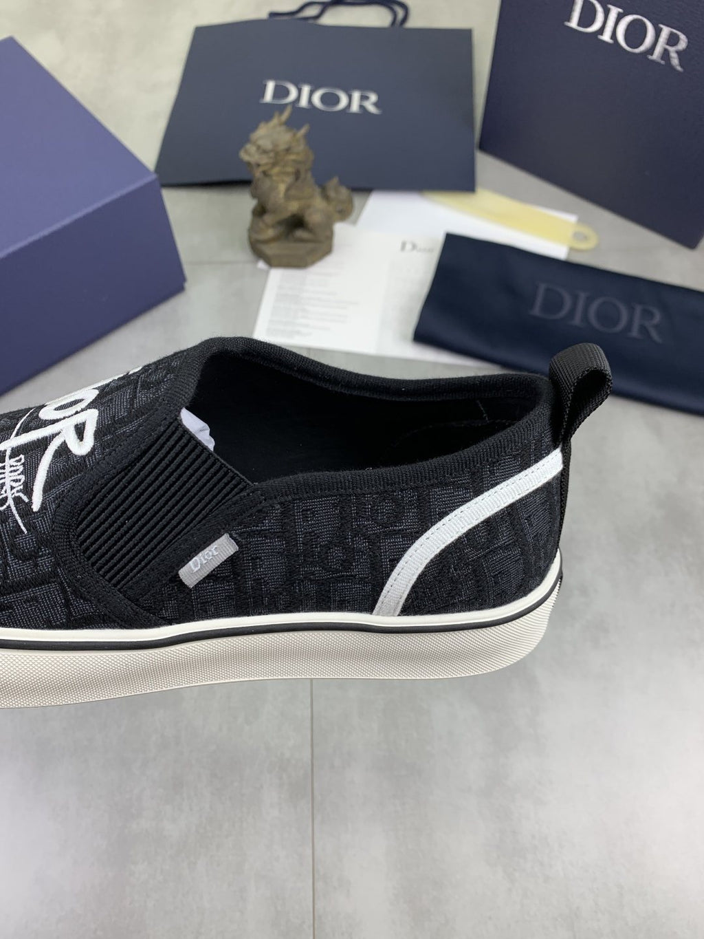 Dior Logo-Pattern Canvas Slip-On Sneakers - Black and White
